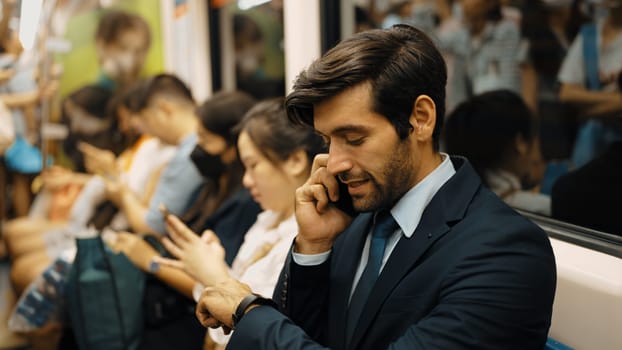 Smiling male investor talking to manager by using phone about project. Happy caucasian business man receive good news about getting promotion while sitting on train. Public transport. Exultant.