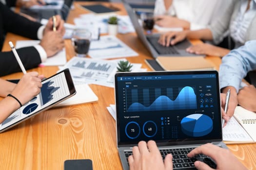 Financial data analysis dashboard by Fintech BI or business intelligence display on laptop screen to in-depth financial data analysis by business people working on business marketing. Habiliment