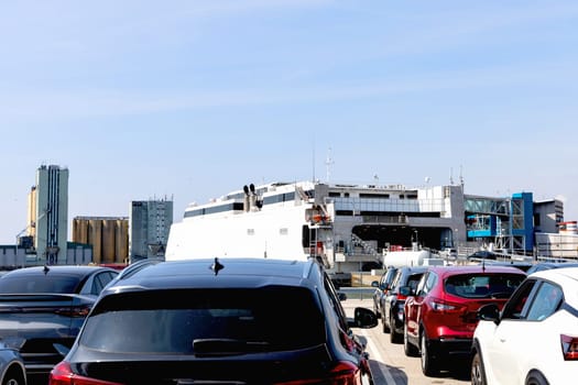 Seaport and terminal for passenger ferry transport in the city of Ystad. Line of cars waiting to board the ferry. High quality photo
