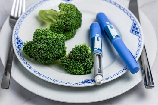 Ozempic Insulin injection pen or insulin cartridge pen for diabetics. Medical equipment for diabetes parients. Copenhagen, Denmark - January 1, 2024.