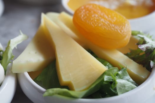 Cheese platter with dry food on a plate ,