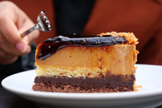 chocolate and cream cake on a plate on table .