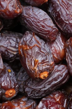 many date fruits display for sale at local market .