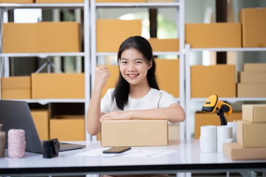 Startup small business entrepreneur SME, asian woman, Portrait of Asian small business owner holding package parcel box isolated on white background, delivery online sell marketing SME concept.