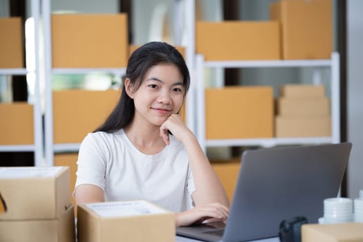Startup small business entrepreneur SME, asian woman, Portrait of Asian small business owner holding package parcel box isolated on white background, delivery online sell marketing SME concept.