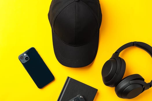 Baseball hat against yellow background in studio close up