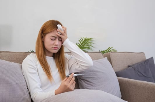 Young Asian woman has headaches from illness or accumulated stress due to health problems and lifestyle problems that cause stress disorder..