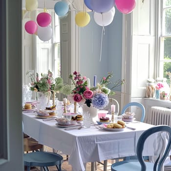 Birthday table decoration with sweets, flowers, candles and pink balloons. Selective focus