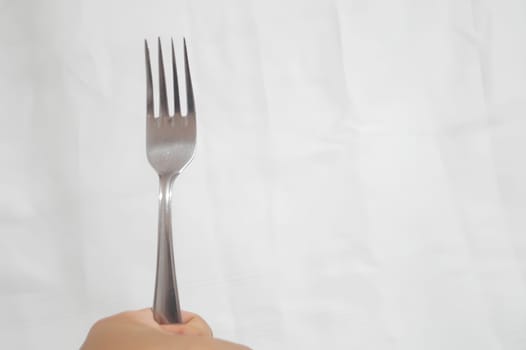 A fork is shown in a white background. High quality photo