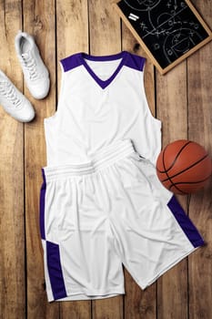 Basketball uniform on wooden background top view flat lay