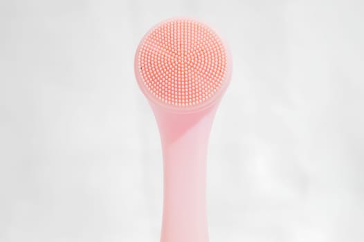 A pink brush with a white handle. High quality photo