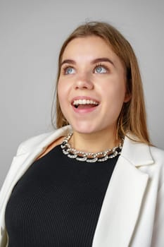 Woman Wearing White Jacket and Black Top close up