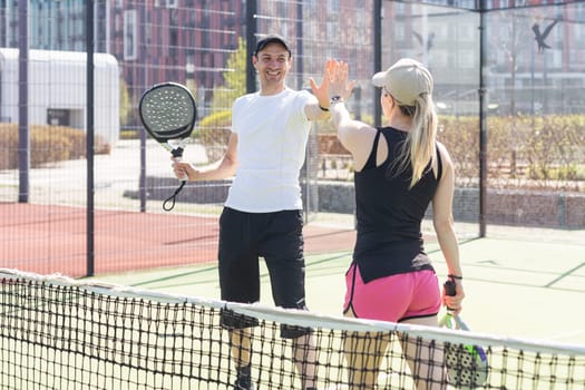 Padel lesson with a coach, personalized instruction in a supportive environment. High quality photo