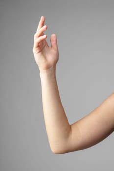 Woman Holding Arm Up in the Air with Gesture close up