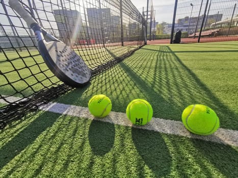 Ukraine Kyiv, April 11 2024. Paddle tennis racket adidas and ball. High quality photo