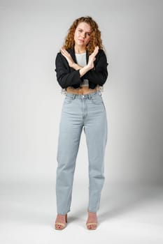 Young Woman Standing With Her Arms Crossed in Studio