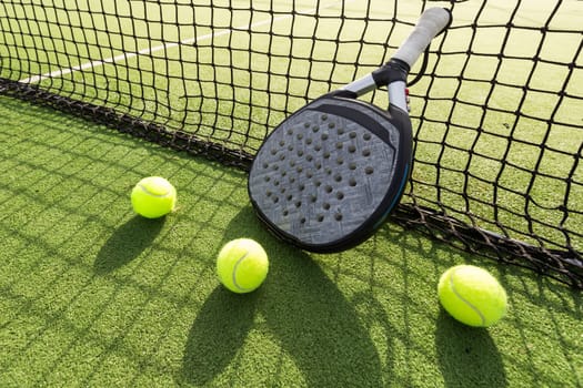 Paddle tennis racket and ball. High quality photo