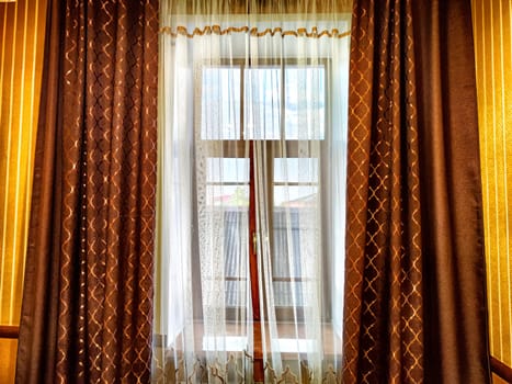 Morning Light Filtering Through Lace Curtains in a Cozy Room. Chiffon curtain on the window in the room