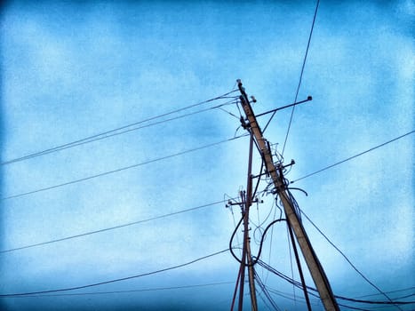 Old pole with wires against the sky. Electric transmission line, Eco-friendly energy