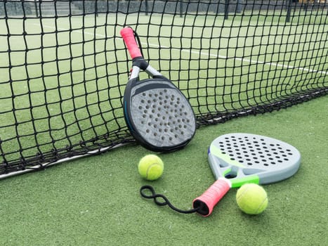 Paddle tennis objects on grass court. High quality photo