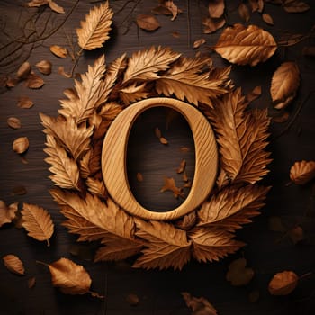 Graphic alphabet letters: Wooden letter O in the shape of a wreath of autumn leaves on a wooden background