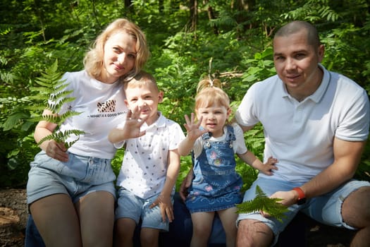 Family playing in the forest