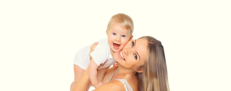 Portrait of happy cheerful smiling young mother playing with cute baby isolated on white studio background