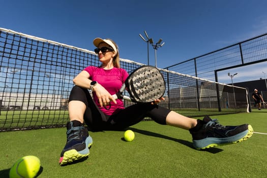 One women playing Paddle tennis. High quality photo