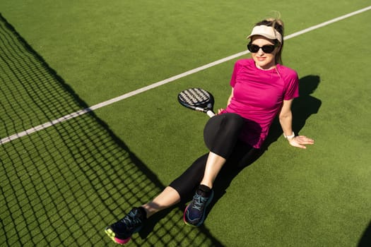 One women playing Paddle tennis. High quality photo