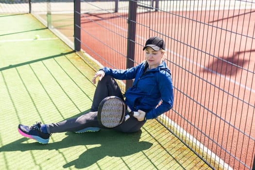 One women playing Paddle tennis. High quality photo