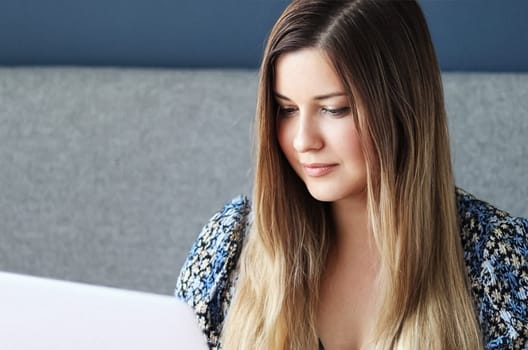 Beautiful woman working at computer desk, from home, female student masters degree course, laptop for elearning, university education, language school or online shopping concept