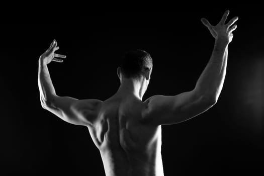 Portrait of man, bodybuilder and bicep flex in a studio, background and exercise for muscular power.