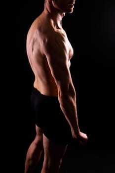 Portrait of man, bodybuilder and bicep flex in a studio, background and exercise for muscular power.