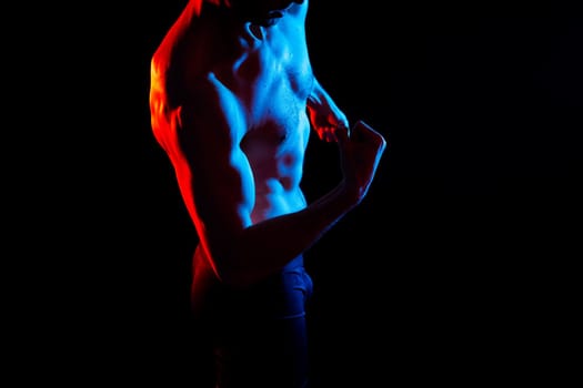 Portrait of man, bodybuilder and bicep flex in a studio, background and exercise for muscular power.