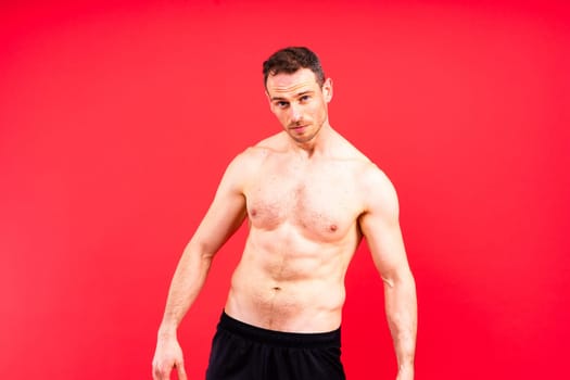 Portrait of man, bodybuilder and bicep flex in a studio, background and exercise for muscular power.