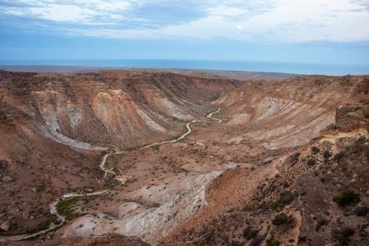 Panoramic composite wide field angle photography as the moon rises over the spectacular Charles Knife canyon, Cape Range National Park, Exmouth, Western Australia