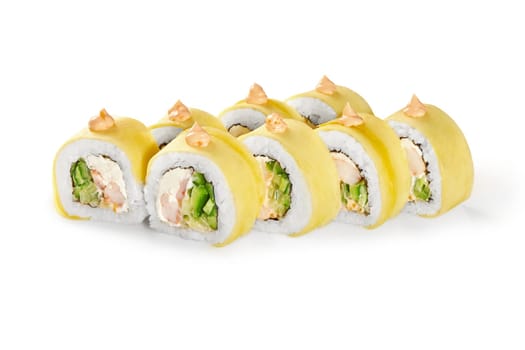 Exotic sushi rolls filled with crab, cream cheese, and cucumber, topped with mango slices and spicy mayo, presented on white background. Japanese style cuisine