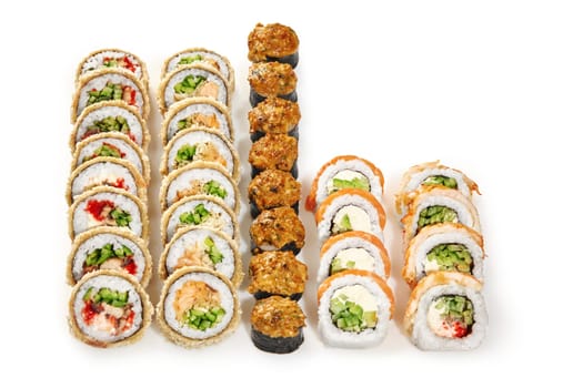 Vibrant set of sushi with crunchy tempura rolls, baked norimaki and uramaki with salmon, shrimp, cream cheese and cucumber, isolated on white. Delicious Japanese style family dinner. Authentic cuisine
