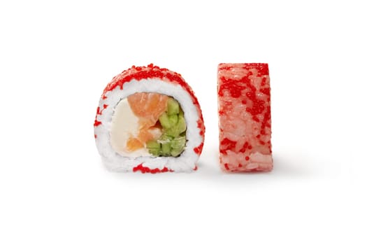 Closeup of classic California sushi roll with fresh salmon, avocado and cucumbers topped with red tobiko on white background. Japanese authentic cuisine