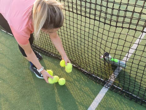 Tennis ball with net in sport club court . . High quality photo