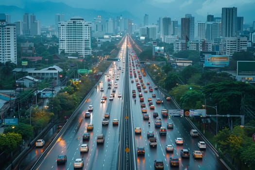 A busy highway filled with traffic flows next to towering skyscrapers and office buildings in an urban cityscape.