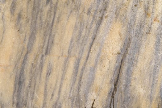 Detailed close-up view of a smooth and veined marble surface showcasing intricate textures and abstract patterns.