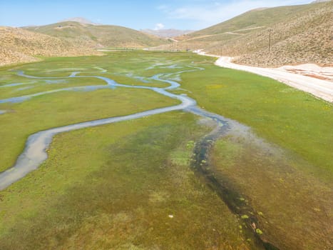 The meander in Antalya Sobucimen plateau. Aerial view of complex waterways weaving  through lush green fields