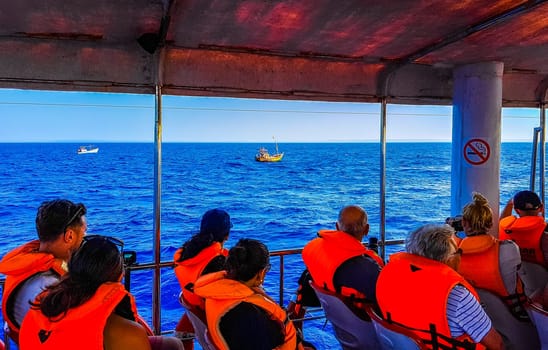 Mirissa Beach Southern Province Sri Lanka 19. March 2018 Boat trip catamaran ship tour blue whale tourists people and sea ocean and water in Mirissa Beach Matara District Southern Province Sri Lanka.