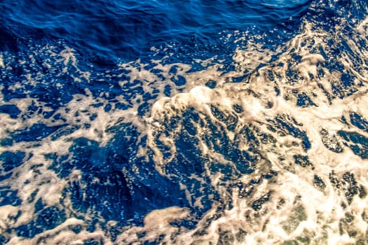 Seascape ocean water and waves on blue whale boat trip catamaran tour in Mirissa Beach Matara District Southern Province Sri Lanka.