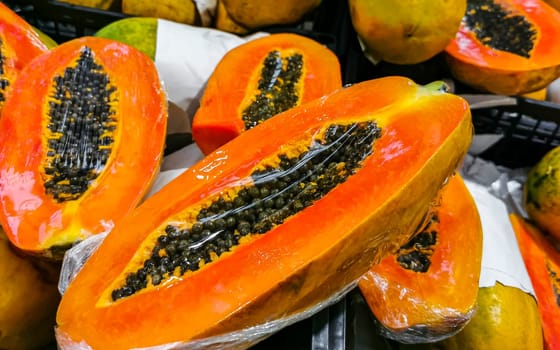 Wrapped packaged sliced papaya fruit in Playa del Carmen Quintana Roo Mexico.