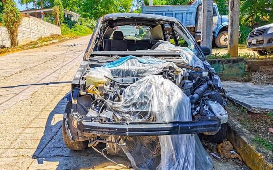 Broken down car Vehicle transportation in the workshop outside in Zicatela Puerto Escondido Oaxaca Mexico.