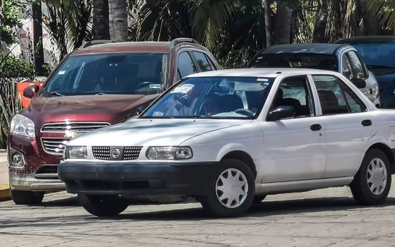 White silver gray grey car vehicle transportation in the city town in Zicatela Puerto Escondido Oaxaca Mexico.