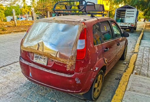 Red modern car vehicle transportation in the city town in Zicatela Puerto Escondido Oaxaca Mexico.