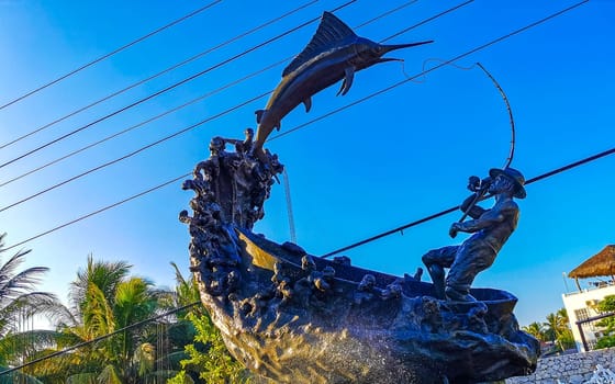 Statue sculpture angler with fish swordfish fountain in Zicatela Puerto Escondido Oaxaca Mexico.